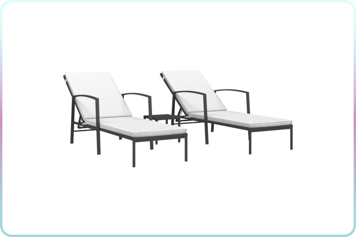 black rattan sun loungers with cream cushions set up by a pool in a backyard, with a matching side table between them.